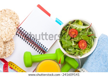 Dumbells, tape measure, healthy food and notepad for copy space. Fitness and health. Isolated on white background