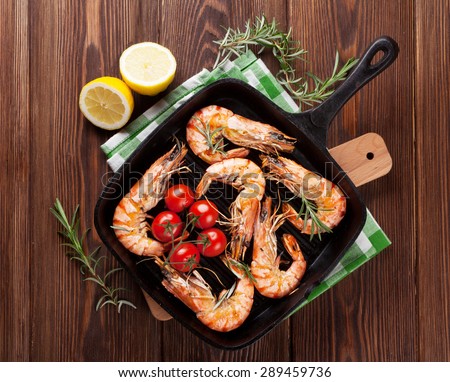 Grilled shrimps on frying pan. Top view
