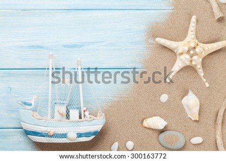 Travel and vacation background with items over sea sand. Top view with copy space