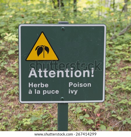 Poison Ivy Warning sign in a forest, Manoir-Papineau National Historic Site, Montebello, Quebec, Canada