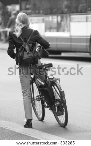 Rear view of a young woman on a bicycle in Paris, France,
