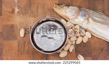 Beer and snacks set: chips, pistachio, shrimp and fish
