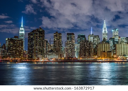 NEW YORK - NOVEMBER 8: Manhattan Skyline at night on November 8, 2013 in New York. Manhattan is the geographically smallest yet most populous of New York City\'s five boroughs.