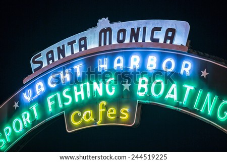 SANTA MONICA - JAN 14, 2015: Santa Monica Yacht Harbor Sport Fishing and Boating Sign in Los Angeles California at Night. Santa Monica is a beachfront city in Los Angeles California.