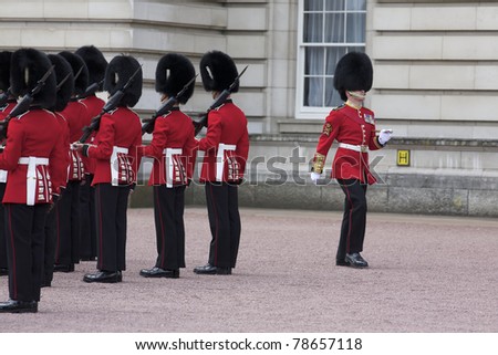 LONDON, ENGLAND- JUNE 21: Changing of the Grenadier Guards outside of Buckingham Palace on June 21, 2009 in London, United Kingdom.  The Grenadier Guards traces its lineage back to the year 1656.