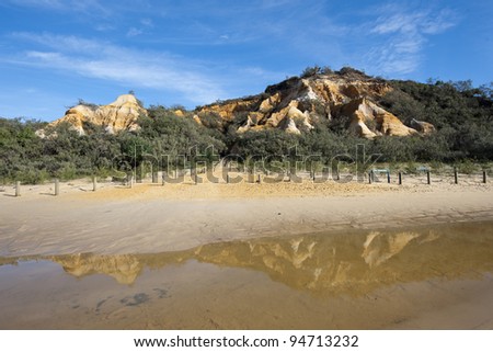 The Pinnacles at Fraser Island and the reflection of it in the foreground