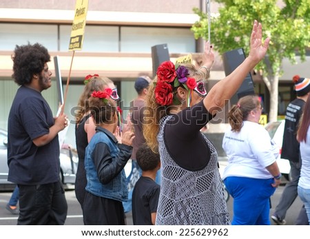 SACRAMENTO, CALIFORNIA - October 22: Protesters march to demonstrate against police brutality in Sacramento, California on October 22, 2014