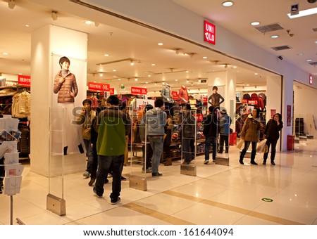 BEIJING-NOV 3: Shoppers at an Uniqlo store on Nov3,2013 in Beijing, China.  Fast Retailing Co., which operates the Uniqlo chain, posted record net sales of Â¥1.143 trillion in the last business year