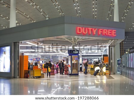 BEIJING, CHINA-JAN.23, 2014: People is seen in a Duty free shop at Beijing Capital International Airport. As of 2014, this airport is the busiest airport in the world in terms of passenger throughput