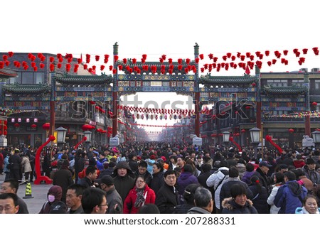 BEIJING, CHINA- FEBRUARY 16, 2010: People enjoy the Spring Festival at Qianmen Street on the third day of the Chinese New Year, the year of the Tiger, which started on February 14 this year.