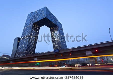 BEIJING, CHINA - MARCH 1st, 2015: China Central Television (CCTV) Headquarters at dusk;  it\'s a 234 m skyscraper. CCTV is the National TV station of China.