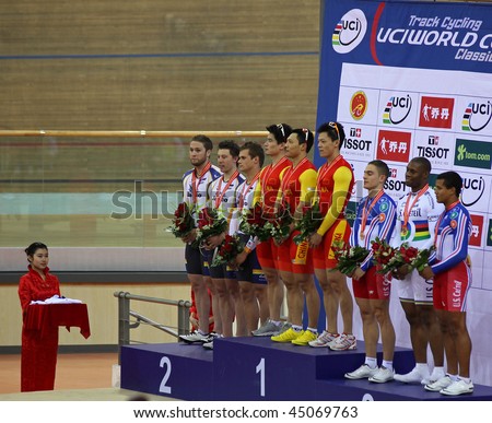 BEIJING - JANUARY 22: Teams awarded are on the podium during Men\'s Team Sprint medal ceremony in the UCI World Cup Classics cycling event on January 22, 2010 in Beijing, China.