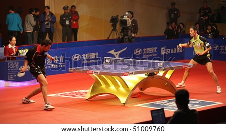 BEIJING - APRIL 15: Vladimir Samsonov (BLR) vs Wang Liqin (CHN) at the HYUNDAI Asia-Europe All Stars Series event day2 on April 15, 2010 in Beijing, China.