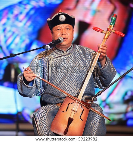SHANGHAI, CHINA - 7: Artist performs on stage during Inner Mongolia Guangdian Arts Ensemble Concert at Shanghai World Expo 2010 on August 7, 2010 in Shanghai, China