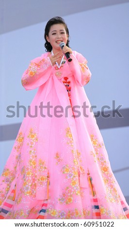 SHANGHAI - SEP 06: Artist from Pyongyang Arts Troupe performs on stage during the DPRK National Pavilion Day celebrations at Shanghai World Expo 2010 on SEP 06, 2010 in Shanghai, China