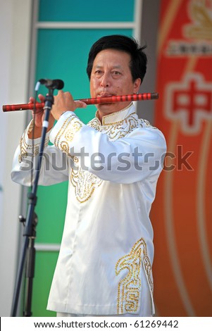 SHANGHAI - SEP 06: A Musician performs on stage during the Folk Culture of Jinshan-Local Residents Activities event at Shanghai World Expo 2010 on Sept 06, 2010 in Shanghai, China