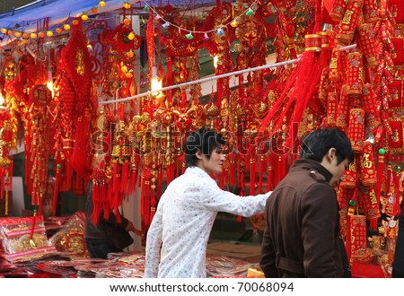 SHENZHEN, CHINA-JAN 26: People shop for Chinese New Year ornaments around the famous Dongmen Pedestrian Street on Jan 26, 2011 in Shenzhen, China, ahead of the Chinese New Year, the year of the rabbit