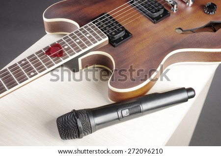 Electric jazz guitar and microphone