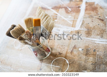 Paint brushes on the workshop table.