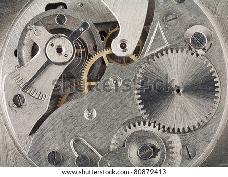Old clock mechanic inside, clockwork close up.