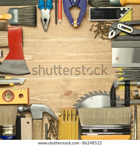 Carpentry tools on a wooden board.