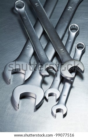 Spanners, wrenches on a metal table