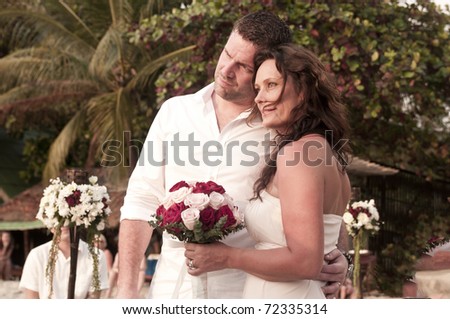 wedding couple on beach getting married