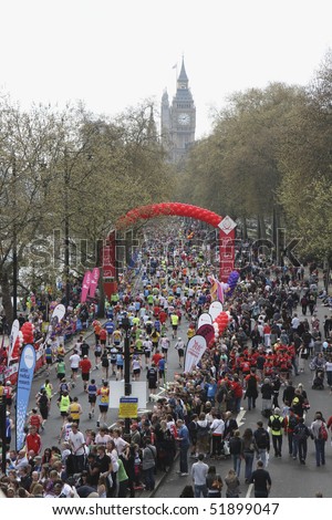 LONDON - APRIL 25: Runners taking part in the Virgin London Marathon on Embankment at the 25 mile marker near Big Ben on April 25, 2010 in Westminster, England
