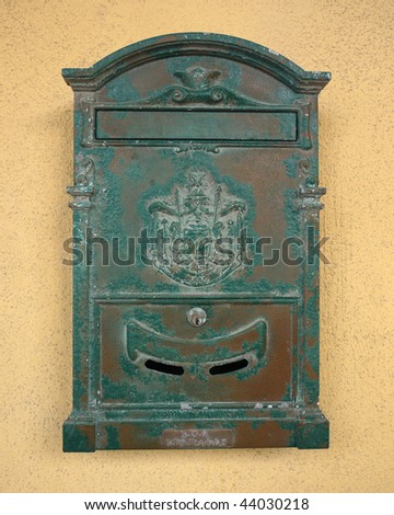 Close-up of very old green mailbox