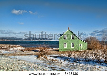 Colorfull sea shore house during winter in Canada