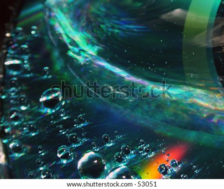 Water drops and rainbow reflections off a cd. makes a great looking desktop background.