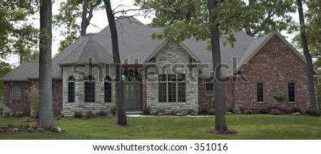 Gorgeous architecture featuring stone work at the entrance of this newer ranch style home home.