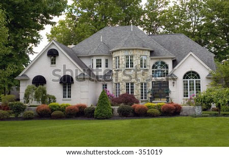 One of he most beautiful house I have seen. Reminds me of a castle with the stone round front architecture and the landscaping is immaculate. Just waiting for a princess to walk out.