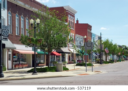 A main street in a typical Midwest small town, complete with U.S. flags.