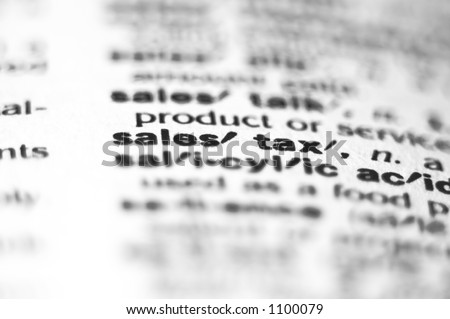 Extreme macro or close up of the word Sales Tax. Very shallow depth of field is intentional and shows only the word sales tax in focus.