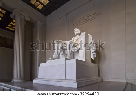A night time shot of Abraham Lincoln\'s statue inside the Lincoln Memorial. Located on the National Mall in Washington DC.