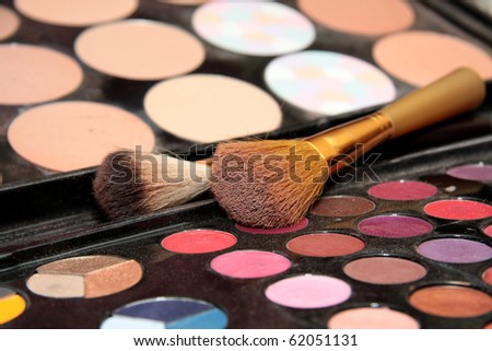 Professional set of cosmetics and shades, brushes.