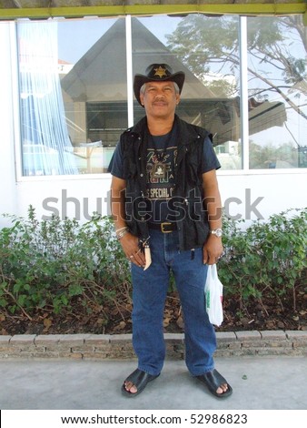 BANGKOK, THAILAND - JANUARY 7 : Thai man dressed in American clothing January 7, 2006 in Bangkok.