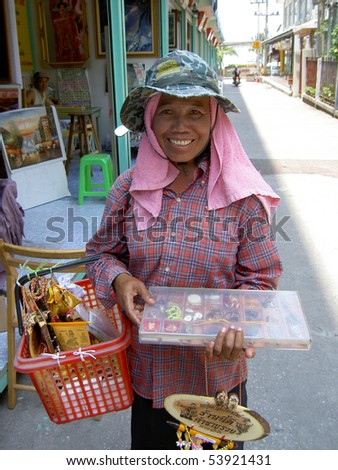 PATTAYA, THAILAND - MARCH 15: Thai woman selling religious ornaments on the roadside on March 15, 2006 in Pattaya.