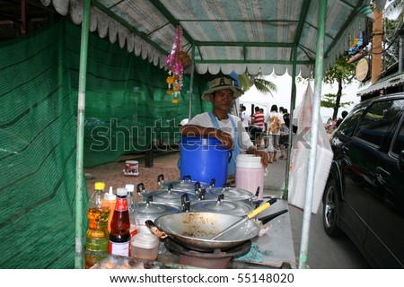 PATTAYA, THAILAND, JUNE 5: Thai man sells Thai food by the roadside on June 5, 2010 in Pattaya.