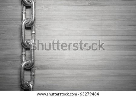 a wooden board with metal chain