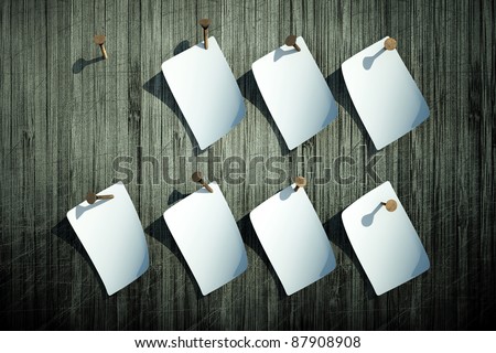 a blank white lists of paper on wooden wall