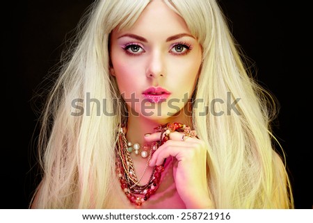 Fashion portrait of elegant woman with magnificent hair. Blonde girl. Jewelry. Perfect make-up