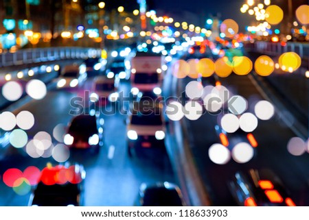 Evening traffic. The city lights. Motion blur. Abstract background.