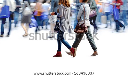 A large group of people walking. Blurred motion