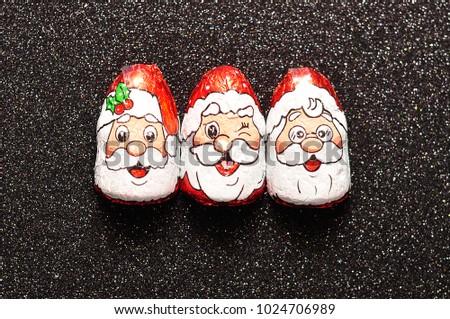 Similar – Image, Stock Photo Chocolate Santa Claus looks out of a white paper bag with starlight