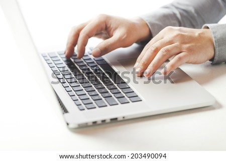 close up image of business man typing on laptop