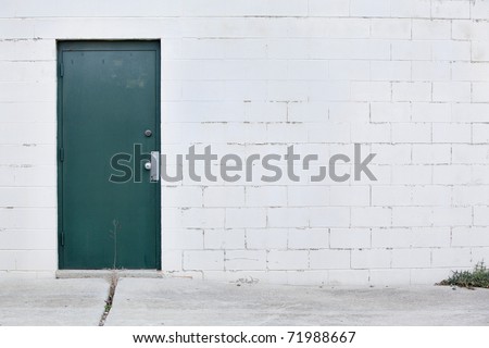 white wall dark green door