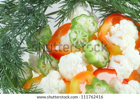 Vegetable salad greens made from okra, cauliflower, red pepper lettuce and dill