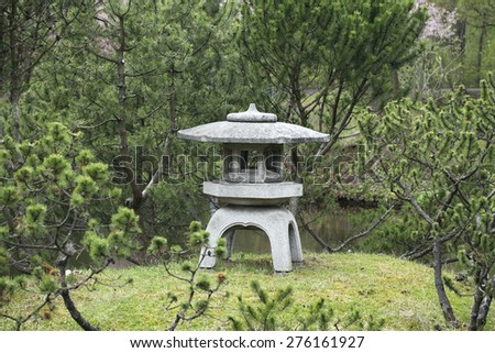 Stone lantern in Japanese garden. Botanical Garden of the Russian Academy of Sciences in Moscow